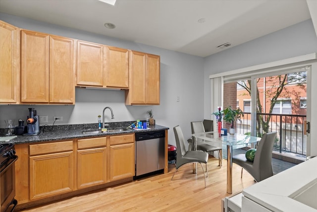 4518 S Woodlawn Ave Unit 4518, Chicago, IL 60653 - kitchen with stainless steel appliances, light wood finished floors, and dark stone counters