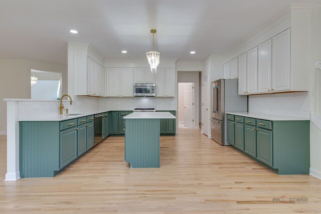 5860 Betty Gloyd Dr, Hoffman Estates, IL 60192 - kitchen featuring green cabinetry, stainless steel appliances, a kitchen island, light wood-style floors, and recessed lighting