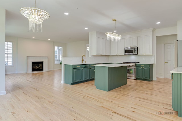 5860 Betty Gloyd Dr, Hoffman Estates, IL 60192 - kitchen with green cabinets, stainless steel appliances, a chandelier, and recessed lighting