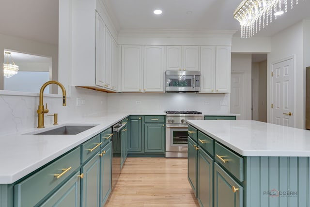 5860 Betty Gloyd Dr, Hoffman Estates, IL 60192 - kitchen with stainless steel appliances, green cabinets, white cabinetry, light wood-style flooring, and light countertops