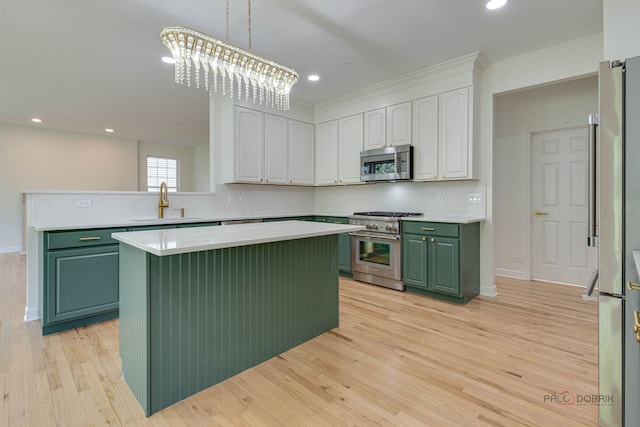 5860 Betty Gloyd Dr, Hoffman Estates, IL 60192 - kitchen with green cabinetry, stainless steel appliances, a kitchen island, decorative backsplash, and white cabinetry