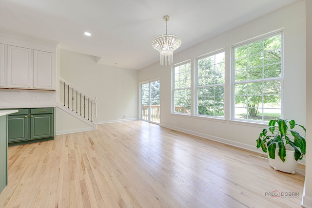 5860 Betty Gloyd Dr, Hoffman Estates, IL 60192 - unfurnished living room with stairs, light wood finished floors, plenty of natural light, and recessed lighting