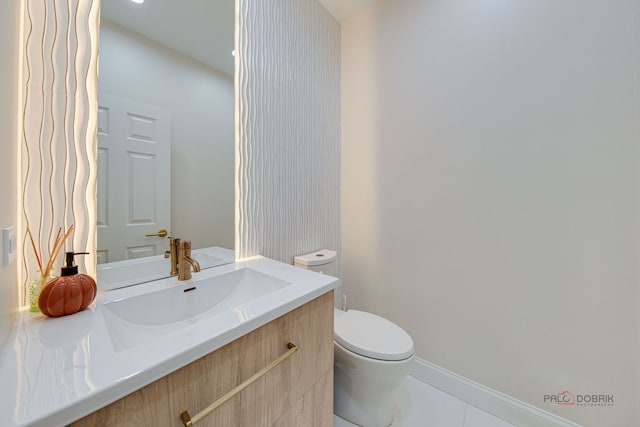 5860 Betty Gloyd Dr, Hoffman Estates, IL 60192 - half bathroom with vanity and tile patterned flooring