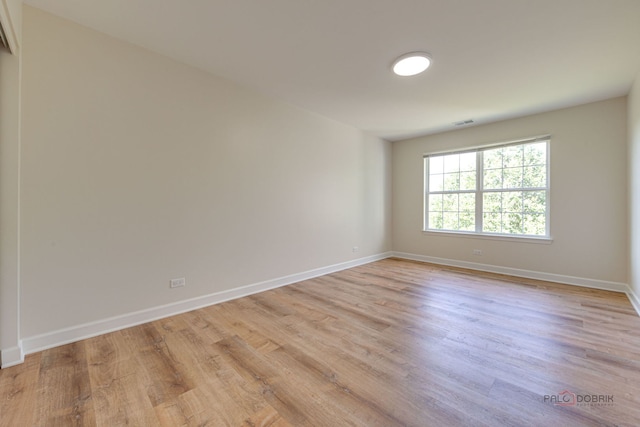 5860 Betty Gloyd Dr, Hoffman Estates, IL 60192 - spare room featuring light wood-type flooring and baseboards