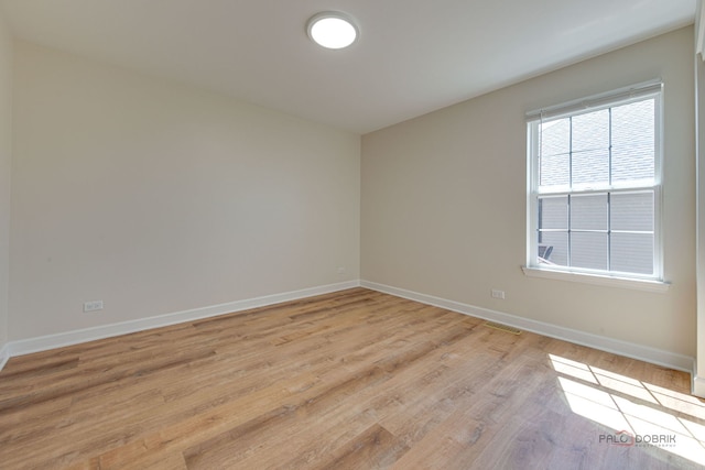 5860 Betty Gloyd Dr, Hoffman Estates, IL 60192 - unfurnished room with baseboards and light wood finished floors