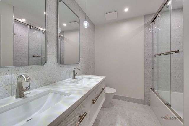 5860 Betty Gloyd Dr, Hoffman Estates, IL 60192 - bathroom featuring double vanity, shower / bath combination with glass door, tile walls, and recessed lighting