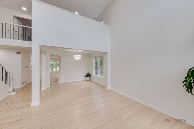 5860 Betty Gloyd Dr, Hoffman Estates, IL 60192 - unfurnished living room featuring stairs, wood finished floors, healthy amount of natural light, a chandelier, and recessed lighting