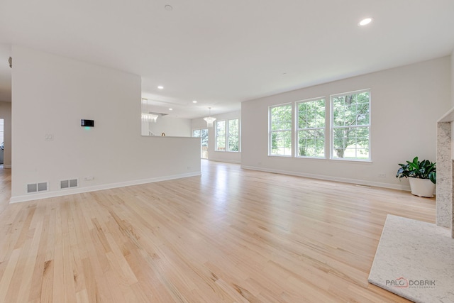 5860 Betty Gloyd Dr, Hoffman Estates, IL 60192 - unfurnished living room with light wood-style flooring and recessed lighting