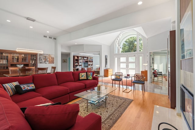 1670 Jasmine Ct, Highland Park, IL 60035 - living room with wood finished floors, lofted ceiling, and recessed lighting