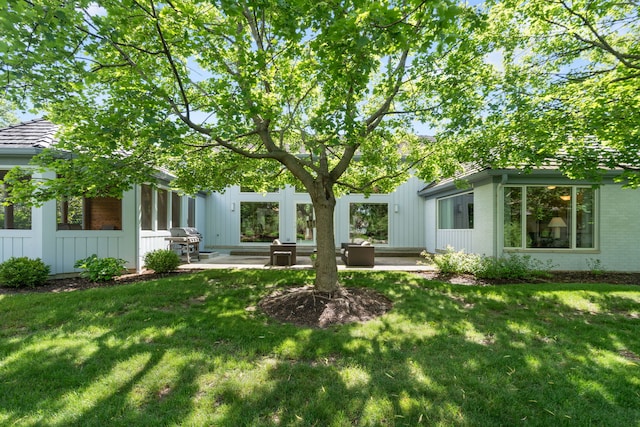 1670 Jasmine Ct, Highland Park, IL 60035 - view of green lawn featuring a patio area