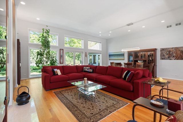 1670 Jasmine Ct, Highland Park, IL 60035 - living area with wood finished floors, recessed lighting, and a towering ceiling