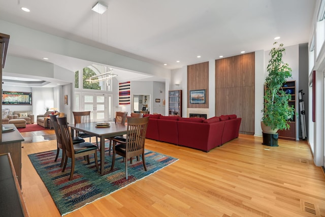 1670 Jasmine Ct, Highland Park, IL 60035 - dining room with light wood-style flooring, recessed lighting, and a fireplace