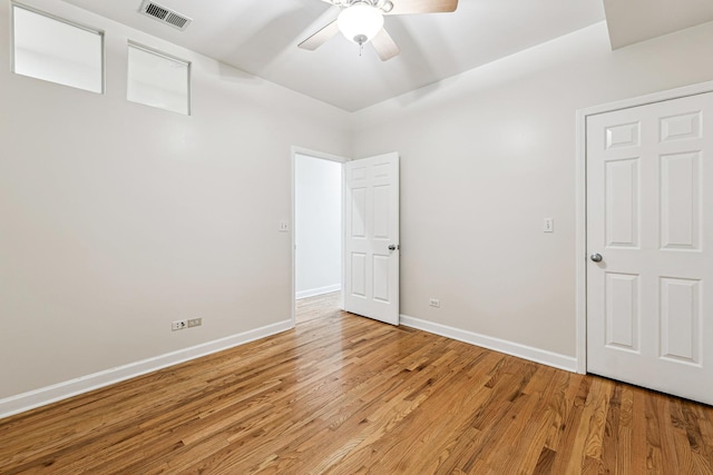 1917 S State St Unit 1, Chicago, IL 60616 - unfurnished bedroom with light wood-style floors and ceiling fan