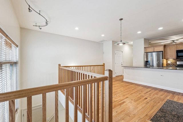 1917 S State St Unit 1, Chicago, IL 60616 - kitchen featuring stainless steel refrigerator with ice dispenser, black microwave, light wood-type flooring, backsplash, and pendant lighting