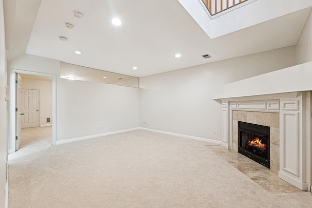 1917 S State St Unit 1, Chicago, IL 60616 - unfurnished living room featuring light carpet, a fireplace, a skylight, and recessed lighting