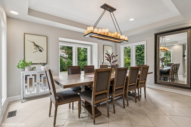 423 S Beverly Ln, Arlington Heights, IL 60005 - dining room with a tray ceiling, a chandelier, light tile patterned floors, and recessed lighting