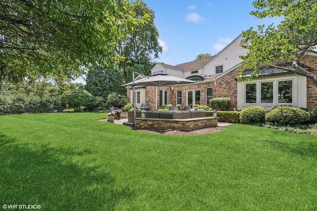 423 S Beverly Ln, Arlington Heights, IL 60005 - rear view of property with a yard, a patio, brick siding, and an outdoor living space