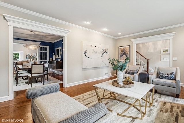 423 S Beverly Ln, Arlington Heights, IL 60005 - living room with wood finished floors, ornamental molding, a chandelier, stairway, and recessed lighting