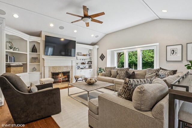 423 S Beverly Ln, Arlington Heights, IL 60005 - living room with vaulted ceiling, ceiling fan, a tiled fireplace, recessed lighting, and wood finished floors