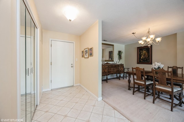 601 Lake Hinsdale Dr Unit 104, Willowbrook, IL 60527 - entrance foyer featuring a chandelier and baseboards