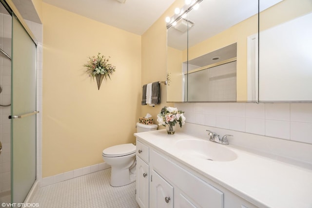 601 Lake Hinsdale Dr Unit 104, Willowbrook, IL 60527 - bathroom featuring vanity, tile patterned floors, an enclosed shower, and tasteful backsplash