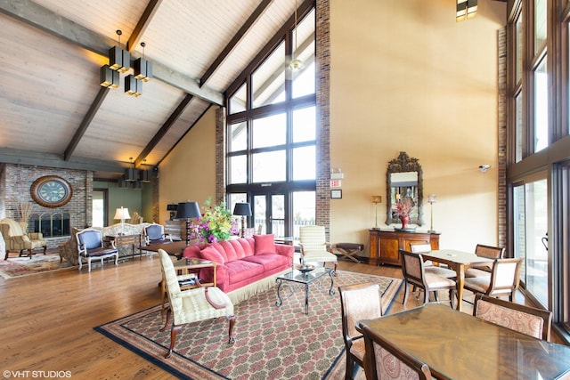 601 Lake Hinsdale Dr Unit 104, Willowbrook, IL 60527 - living area with high vaulted ceiling, wood finished floors, a brick fireplace, plenty of natural light, and a wooden ceiling with exposed beams