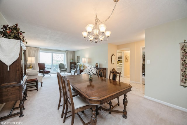 601 Lake Hinsdale Dr Unit 104, Willowbrook, IL 60527 - dining space with a chandelier and light colored carpet