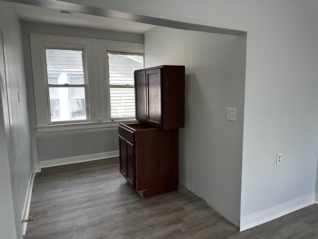 7621 S Eberhart Ave, Chicago, IL 60619 - kitchen featuring dark brown cabinetry and dark wood-style floors