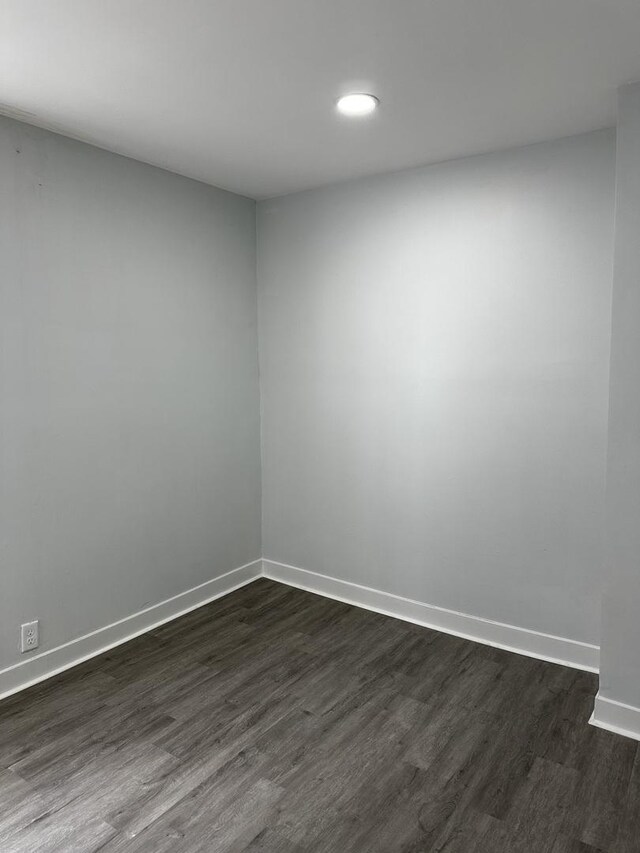 7621 S Eberhart Ave, Chicago, IL 60619 - empty room featuring dark wood-style floors and recessed lighting