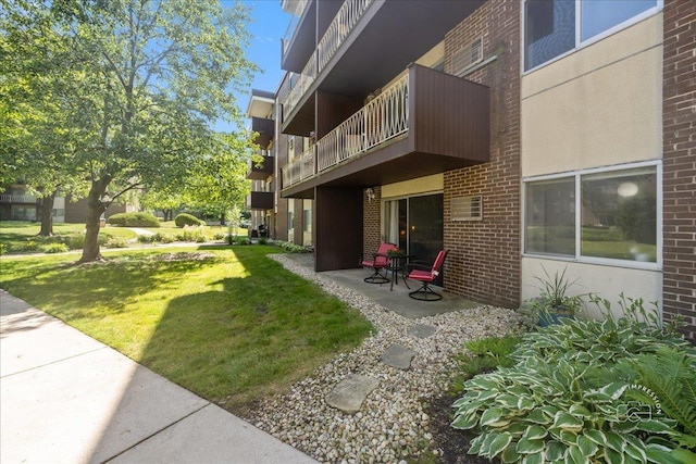 1321 S Finley Rd Unit 108, Lombard, IL 60148 - view of green lawn with a balcony and a patio