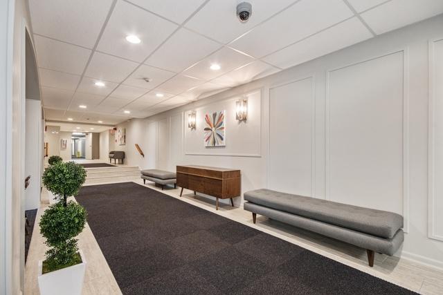 1321 S Finley Rd Unit 108, Lombard, IL 60148 - lobby featuring a decorative wall, a drop ceiling, and recessed lighting
