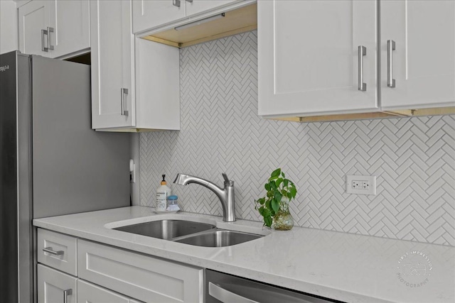1321 S Finley Rd Unit 108, Lombard, IL 60148 - kitchen featuring white cabinetry, tasteful backsplash, stainless steel appliances, and light stone counters