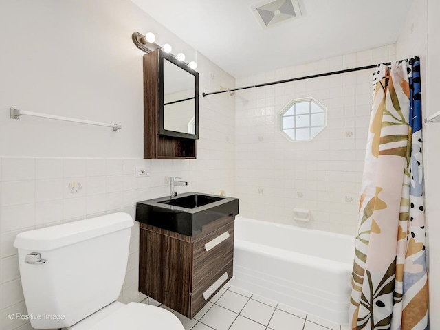 118 Burlington Ave, Clarendon Hills, IL 60514 - bathroom featuring tile walls, shower / tub combo with curtain, vanity, and tile patterned flooring