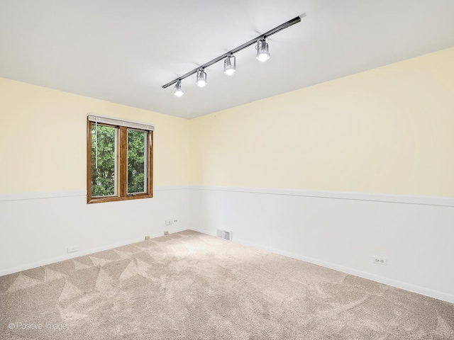 118 Burlington Ave, Clarendon Hills, IL 60514 - unfurnished room featuring rail lighting and carpet