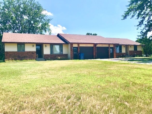 29176 Terra Vista Dr, Rock Falls, IL 61071 - single story home with a garage, brick siding, and a front lawn