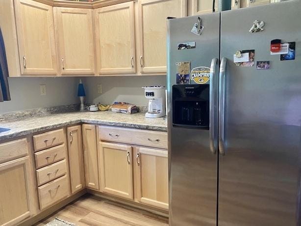 29176 Terra Vista Dr, Rock Falls, IL 61071 - kitchen featuring stainless steel refrigerator with ice dispenser, light wood finished floors, light stone countertops, and light brown cabinets