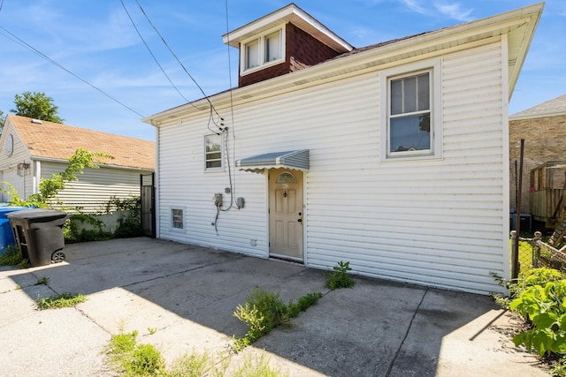 6612 N Mozart St, Chicago, IL 60645 - rear view of house featuring a patio
