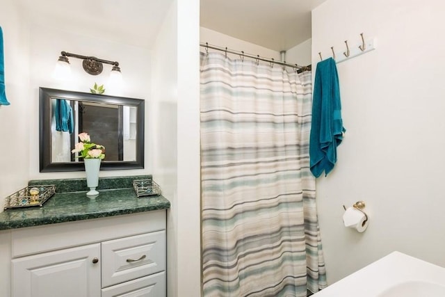 6612 N Mozart St, Chicago, IL 60645 - bathroom with vanity and a shower with shower curtain