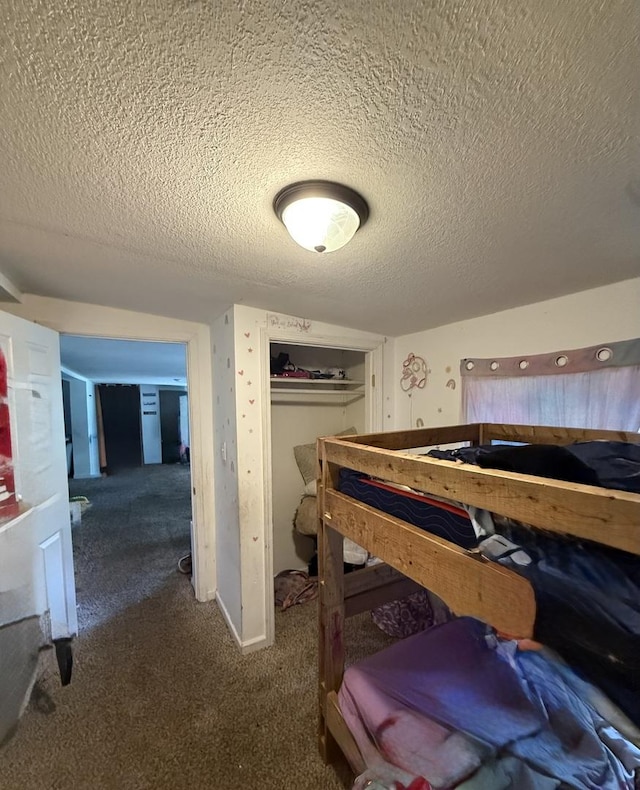 24041/2 W John St, Champaign, IL 61820 - bedroom with a textured ceiling, carpet floors, and a closet