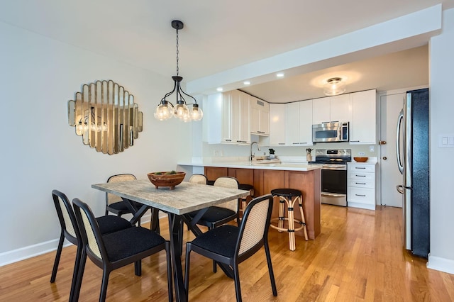 6007 N Sheridan Rd Unit 36F, Chicago, IL 60660 - dining area with recessed lighting, light wood-style floors, and a chandelier