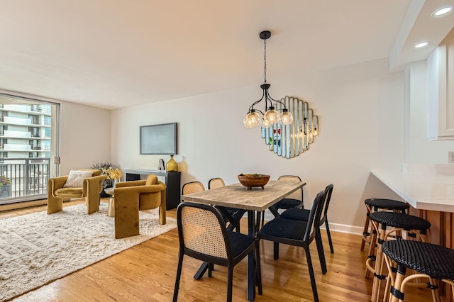 6007 N Sheridan Rd Unit 36F, Chicago, IL 60660 - dining room with light wood-type flooring, recessed lighting, and a chandelier