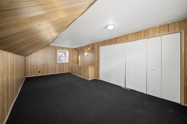 12216 S Carpenter St, Chicago, IL 60643 - additional living space featuring wooden walls, vaulted ceiling, and dark carpet
