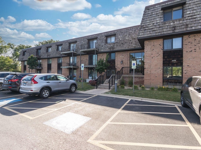 1 Oak Creek Dr Unit 2305, Buffalo Grove, IL 60089 - view of property featuring uncovered parking