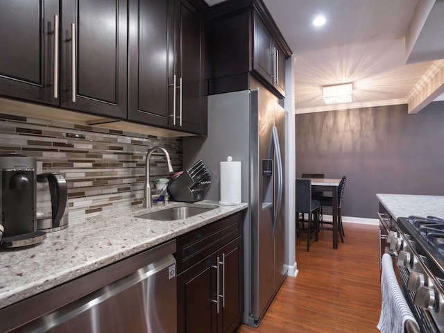1 Oak Creek Dr Unit 2305, Buffalo Grove, IL 60089 - kitchen featuring appliances with stainless steel finishes, backsplash, wood finished floors, and light stone countertops