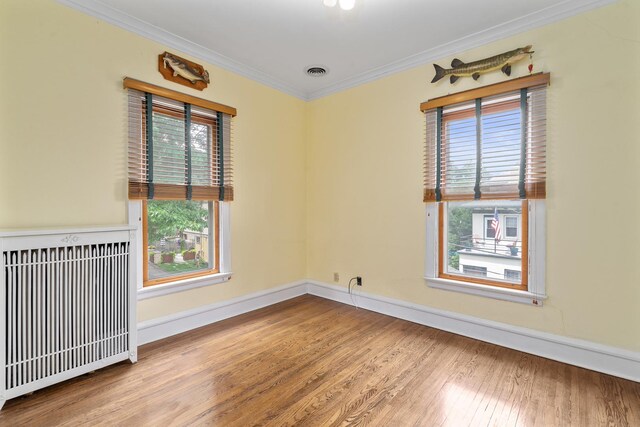 311 Nicholson St, Joliet, IL 60435 - spare room with ceiling fan, wood finished floors, and crown molding