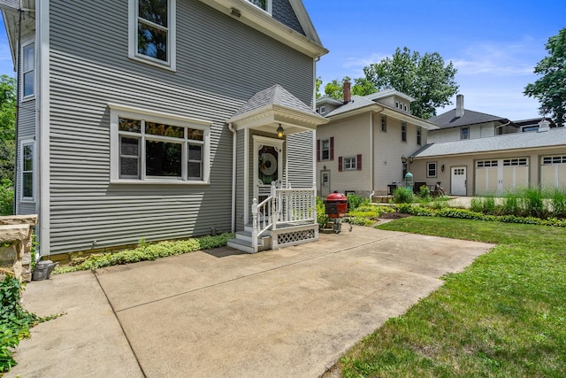 311 Nicholson St, Joliet, IL 60435 - rear view of property with a patio and a yard