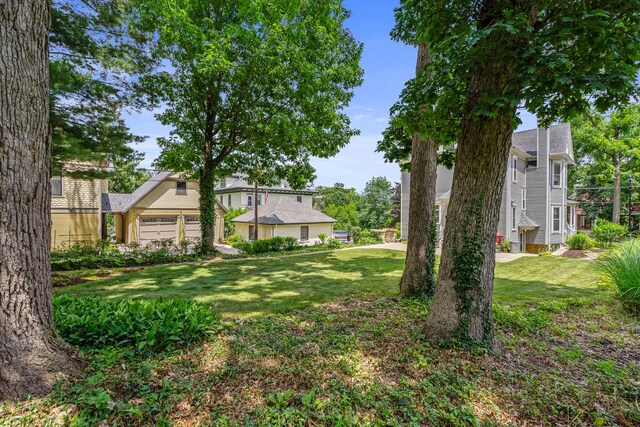 311 Nicholson St, Joliet, IL 60435 - view of green lawn with an outbuilding and a patio area