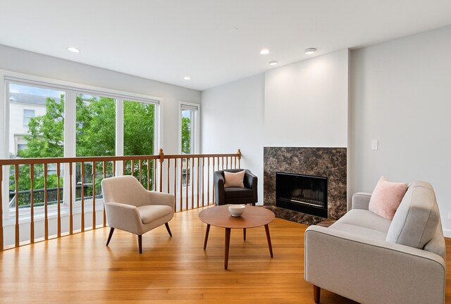 3041 N California Ave Unit 1, Chicago, IL 60618 - sitting room with light wood-style flooring, a fireplace, and recessed lighting