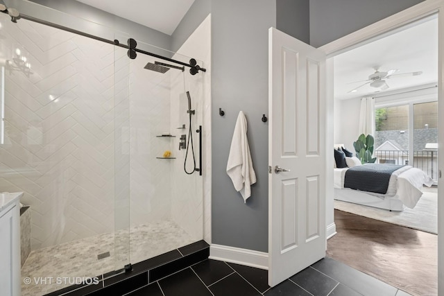 2259 W Wabansia Ave Unit 309, Chicago, IL 60647 - ensuite bathroom featuring a shower stall, tile patterned flooring, and ceiling fan