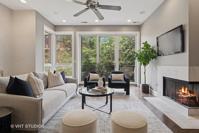 2259 W Wabansia Ave Unit 309, Chicago, IL 60647 - living area with a premium fireplace, recessed lighting, ceiling fan, and wood finished floors
